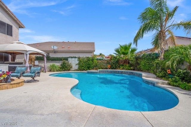 view of pool featuring a gazebo, a fenced in pool, a patio, and a jacuzzi