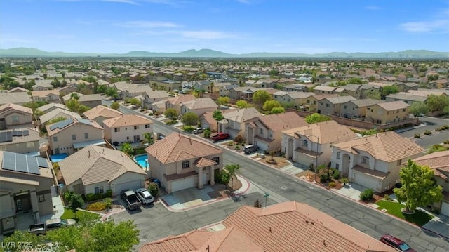 drone / aerial view featuring a mountain view and a residential view