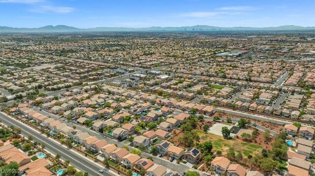 aerial view featuring a mountain view and a residential view