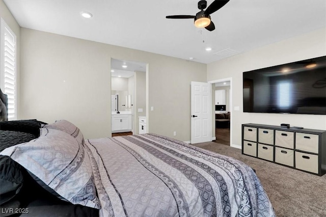 carpeted bedroom featuring recessed lighting, connected bathroom, baseboards, and a ceiling fan