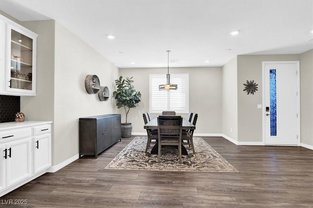 dining space featuring recessed lighting, baseboards, and dark wood-style flooring