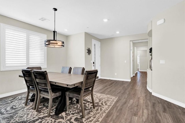 dining space with recessed lighting, wood finished floors, and baseboards