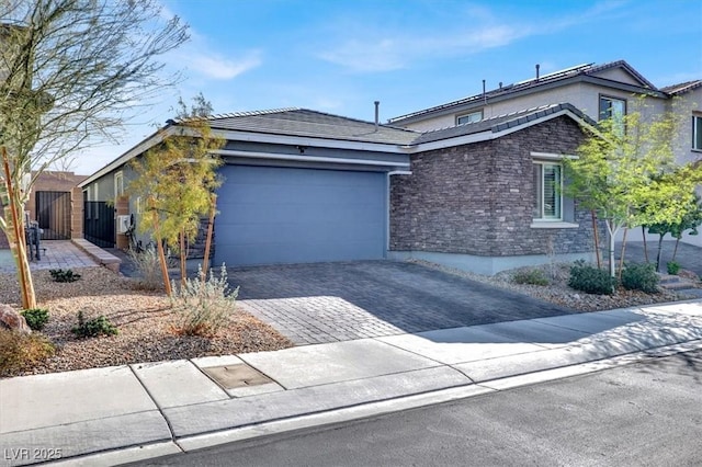 view of front of property featuring a garage and driveway