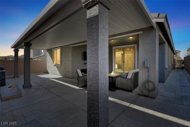 view of patio featuring fence