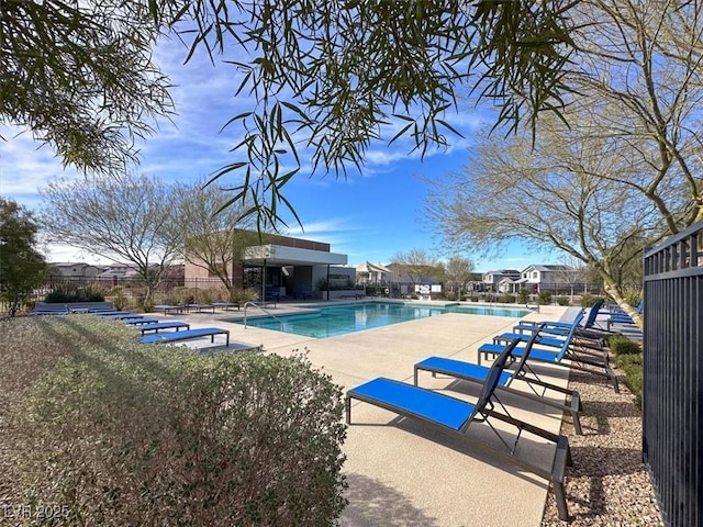 pool featuring a patio and fence