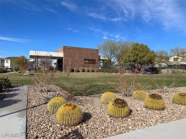 exterior space with a lawn and fence