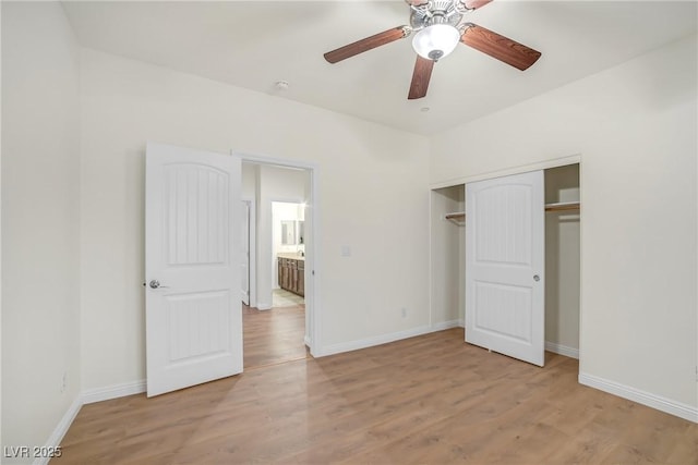 unfurnished bedroom featuring a closet, ceiling fan, baseboards, and wood finished floors