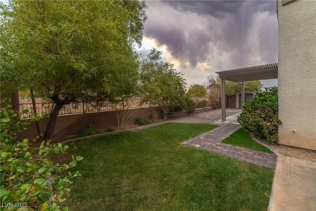 view of yard with a patio, a fenced backyard, and a pergola