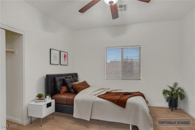 bedroom featuring visible vents, a ceiling fan, and baseboards