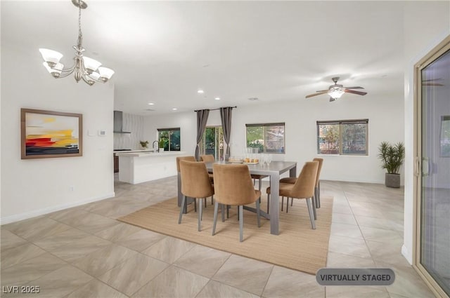 dining space featuring ceiling fan with notable chandelier, recessed lighting, and baseboards