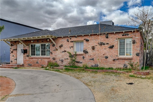 view of front of house with brick siding