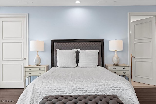 bedroom featuring recessed lighting and wood finished floors