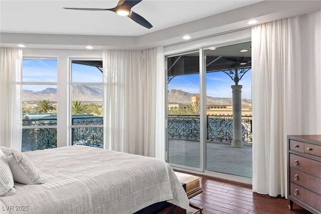 bedroom with dark wood-type flooring, access to outside, and ceiling fan