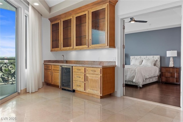 bar featuring wet bar, wine cooler, and a ceiling fan