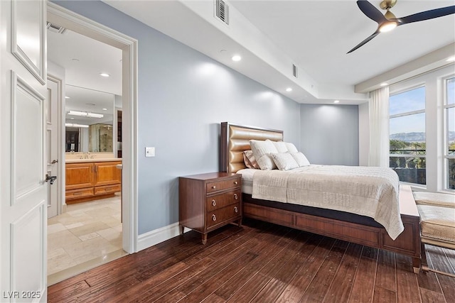 bedroom featuring recessed lighting, wood finished floors, visible vents, and baseboards