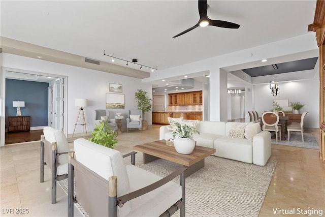 living room with light tile patterned floors, baseboards, visible vents, ceiling fan, and rail lighting