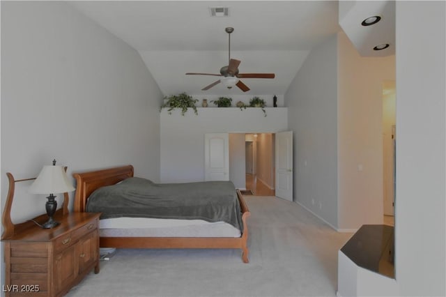 bedroom with light carpet, visible vents, and lofted ceiling