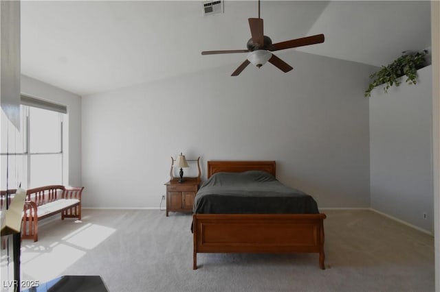 carpeted bedroom featuring lofted ceiling, baseboards, visible vents, and ceiling fan