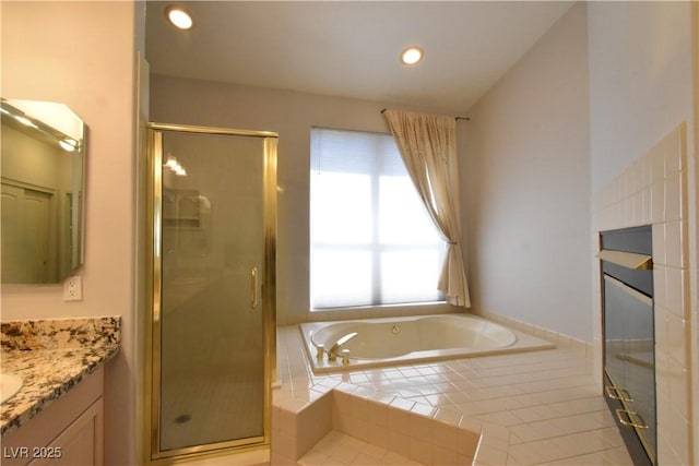 full bath featuring a bath, recessed lighting, a shower stall, and vanity