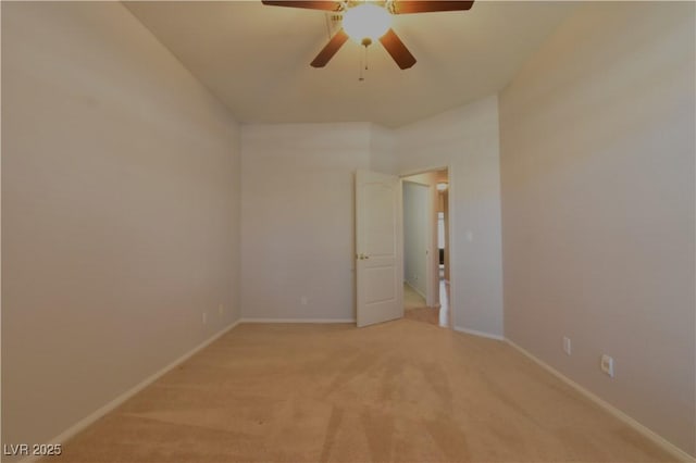 unfurnished room with baseboards, light carpet, and ceiling fan