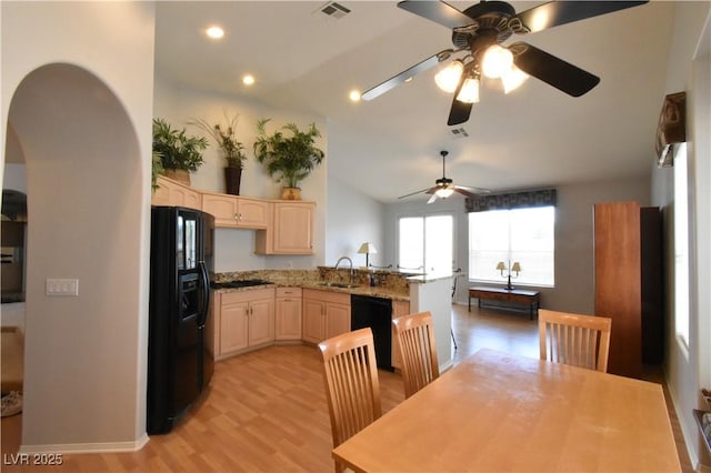 kitchen with visible vents, light brown cabinets, dishwashing machine, black fridge with ice dispenser, and a sink