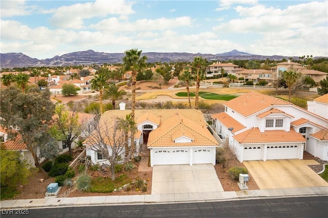 birds eye view of property with a residential view and a mountain view