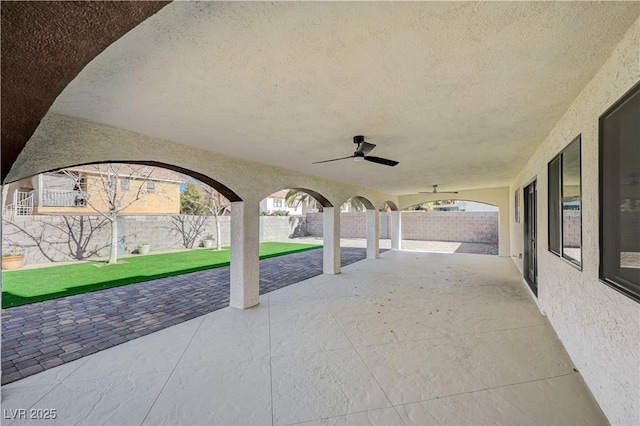 view of patio / terrace with a fenced backyard and a ceiling fan