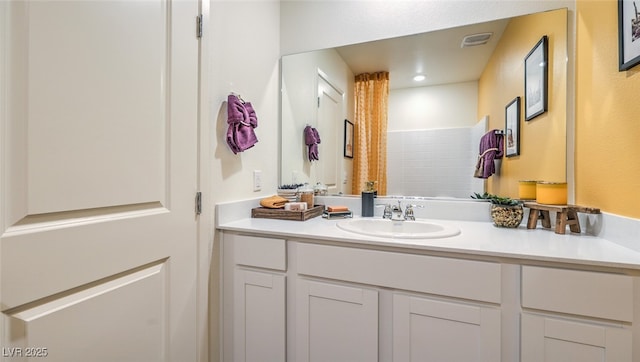 bathroom with visible vents and vanity