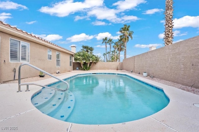 view of swimming pool featuring a fenced in pool, a patio, and a fenced backyard