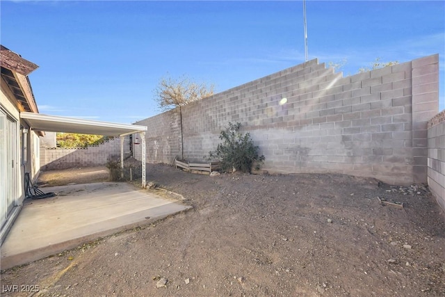 view of yard with a fenced backyard and a patio