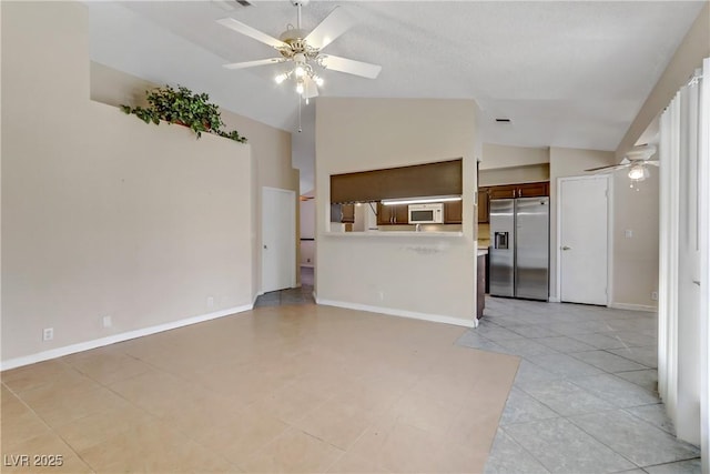 unfurnished living room featuring visible vents, light tile patterned floors, baseboards, ceiling fan, and vaulted ceiling