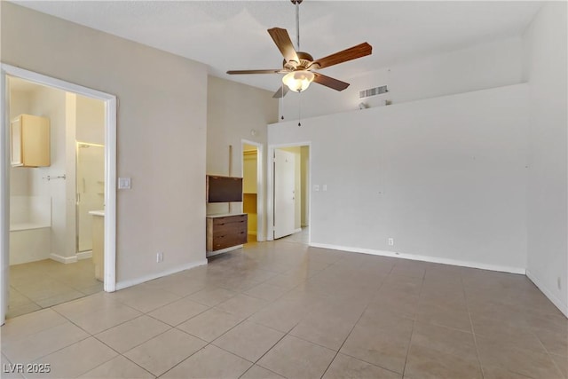 unfurnished room with light tile patterned flooring, visible vents, baseboards, and ceiling fan