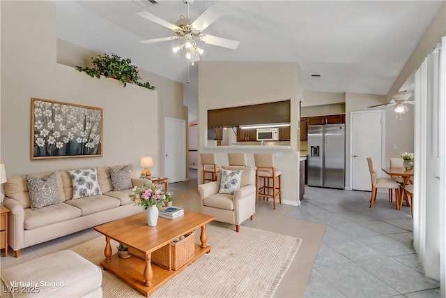 living room with light tile patterned floors, a ceiling fan, and high vaulted ceiling