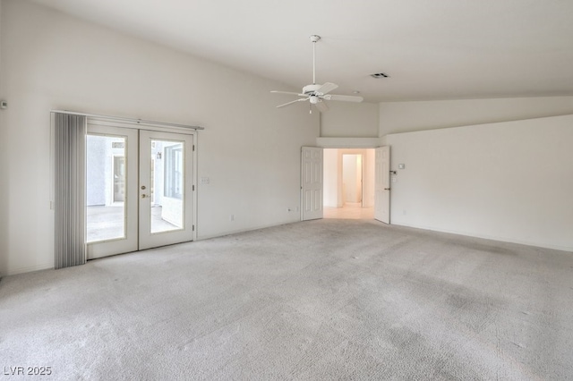 unfurnished room featuring visible vents, high vaulted ceiling, french doors, carpet, and ceiling fan