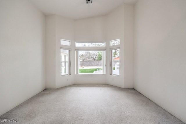 3710 E Oquendo Rd, Las Vegas, NV 89120 - unfurnished room featuring carpet floors and a high ceiling