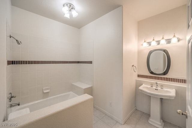 bathroom featuring shower / bath combination, baseboards, and tile patterned flooring