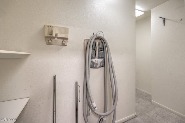 interior details featuring carpet flooring and baseboards