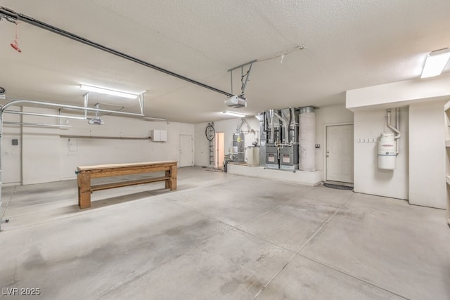 garage featuring strapped water heater and a garage door opener