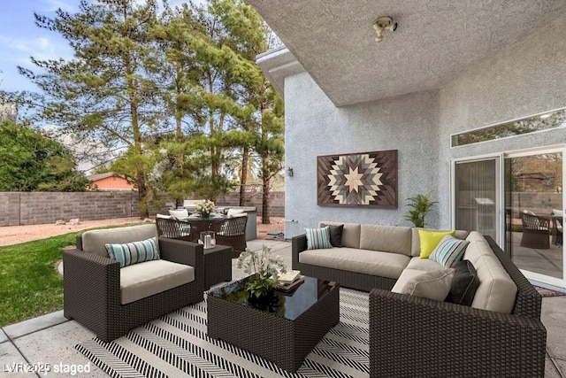 3710 E Oquendo Rd, Las Vegas, NV 89120 - fenced backyard with an outdoor hangout area, outdoor dining area, and a patio