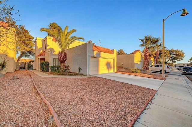 view of front of property with a garage and stucco siding