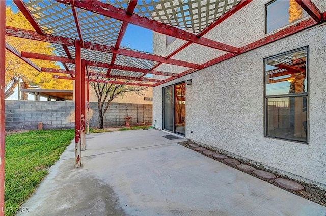 view of patio / terrace featuring fence and a pergola