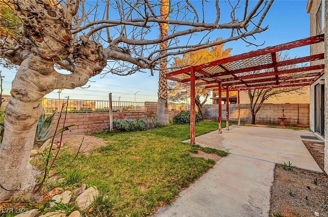 view of yard with a fenced backyard, a pergola, and a patio