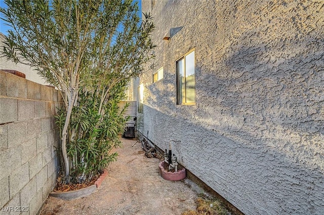 view of side of property with fence