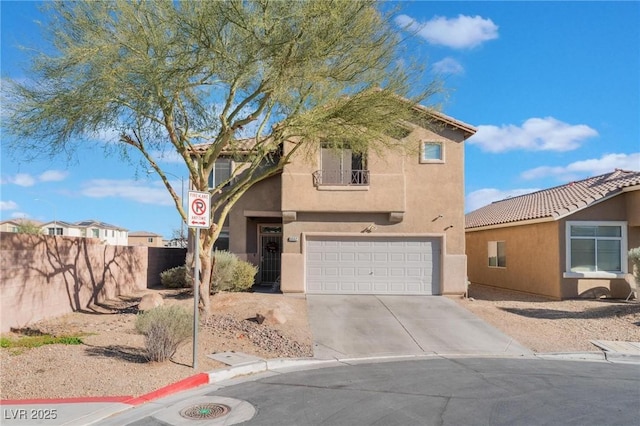 view of front of house featuring concrete driveway, fence, a garage, and stucco siding