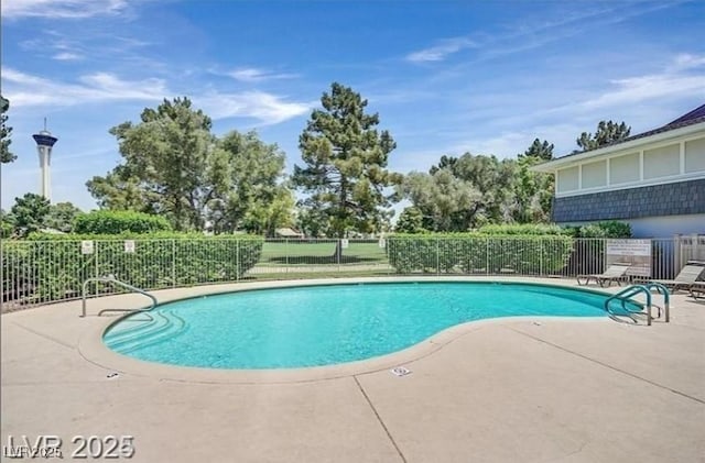 pool featuring a patio area and fence