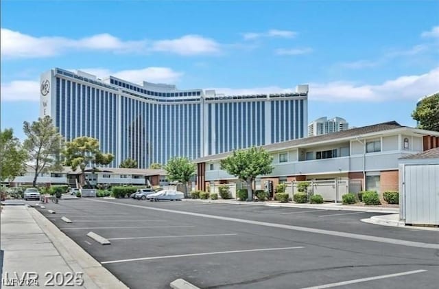 view of building exterior featuring uncovered parking