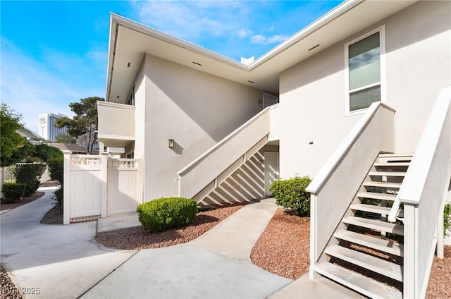 doorway to property with stucco siding