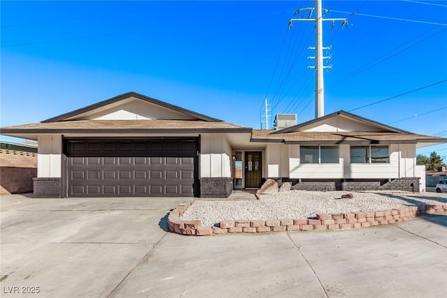 ranch-style home featuring driveway and an attached garage