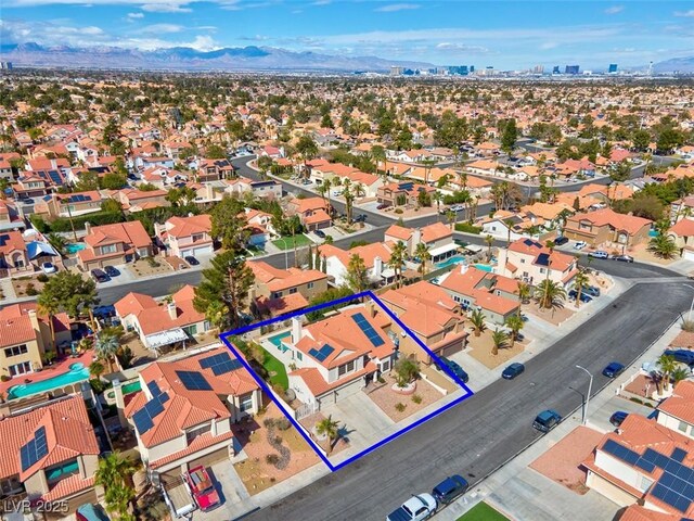 drone / aerial view with a residential view and a mountain view