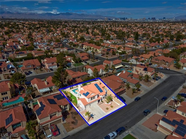 birds eye view of property featuring a residential view and a mountain view